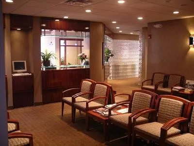 Modern orthodontic office waiting room with comfortable seating and professional reception desk